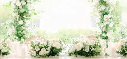 Greenery and flowers on a table setting at a vineyard wedding venue in Niagara, Canada.