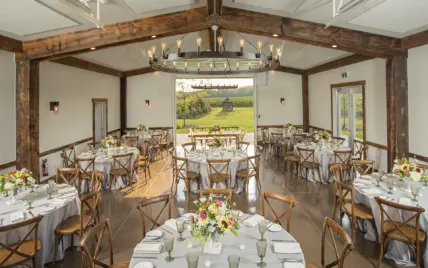 A barn wedding reception hosted at Cave Spring Vineyard in Beamsville.