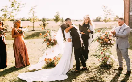 A couple tying the knot in a vineyard in Niagara, Ontario.